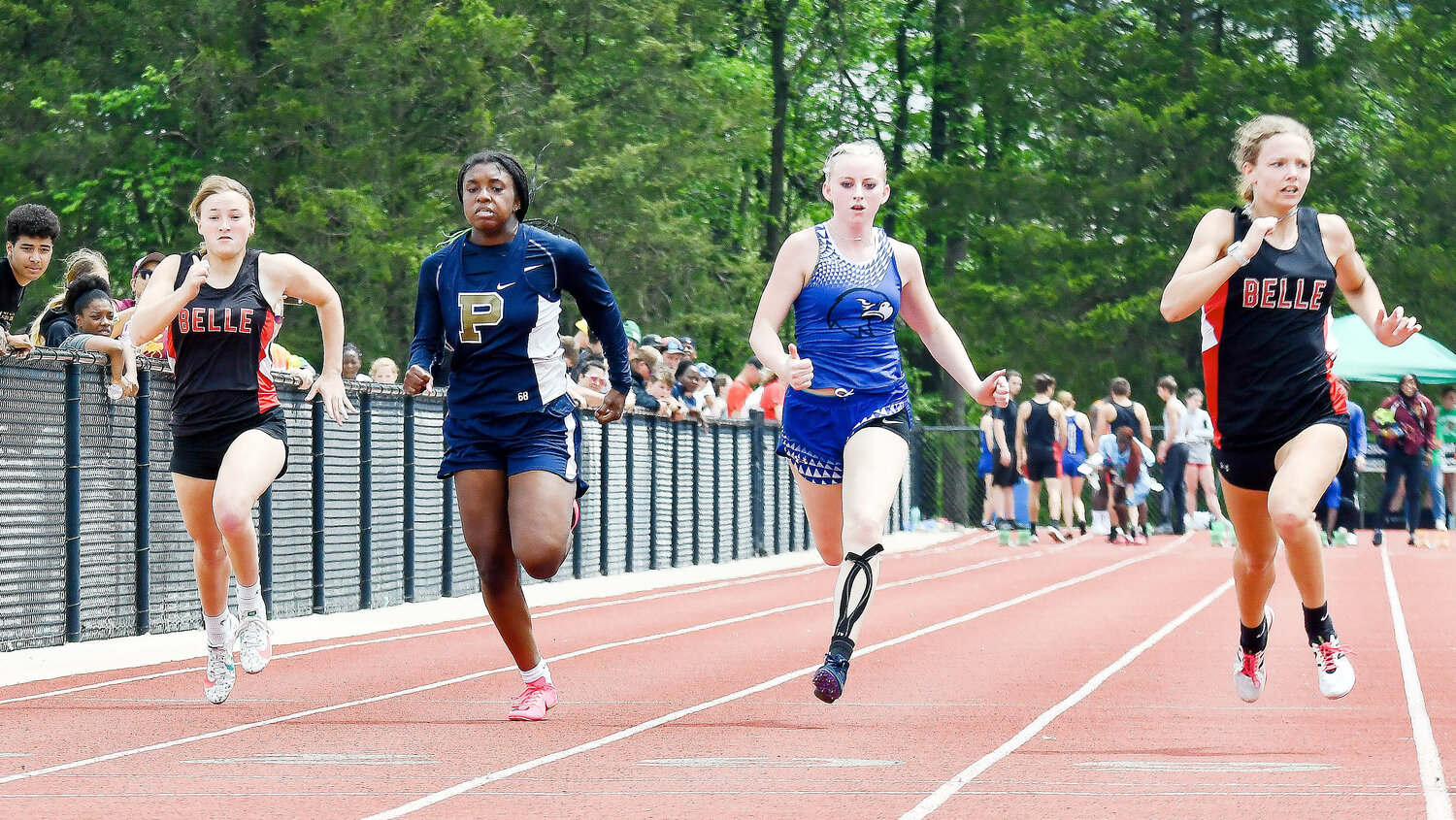 Aubrey Rehmert (far left) and Hali Naber (far right) sprint down the track during the finals of the girls 100-meter dash at the Missouri State High School Activities Association (MSHSAA) Class 2, District 2 meet held Saturday at New Haven High School. Naber placed second to qualify for sectionals.